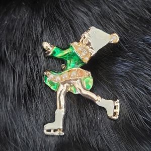 Vintage ice skating girl with pearls brooch